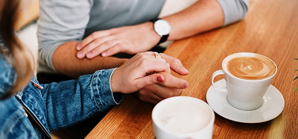 Couple talking over coffee